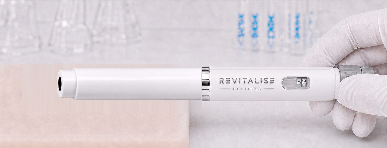 The capped Revitalise pen pressed against a silicone training pad