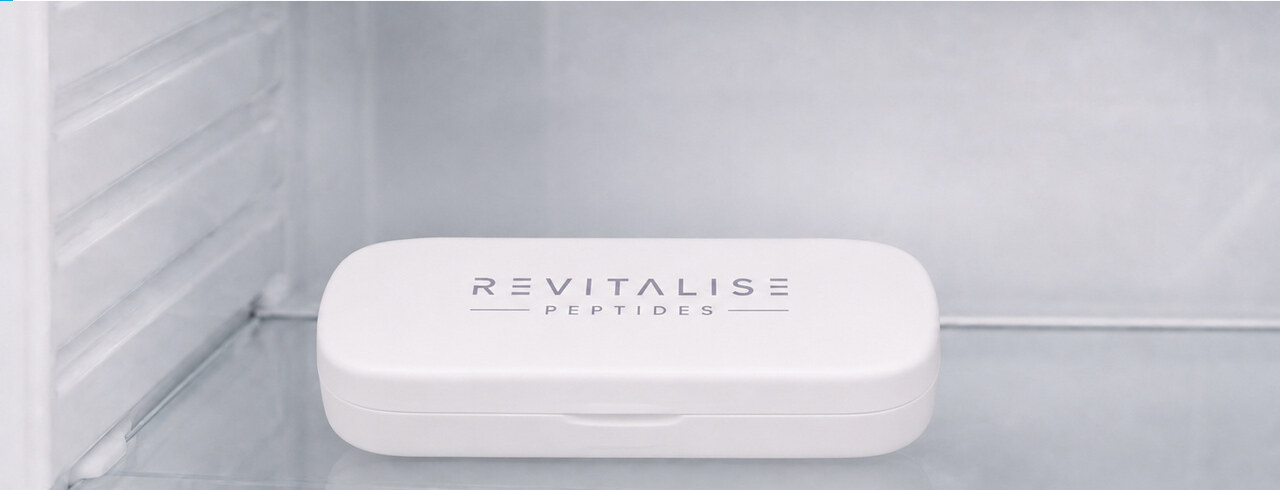 The closed white Revitalise Peptides pen case stored on a refrigerator shelf at four degrees Celsius